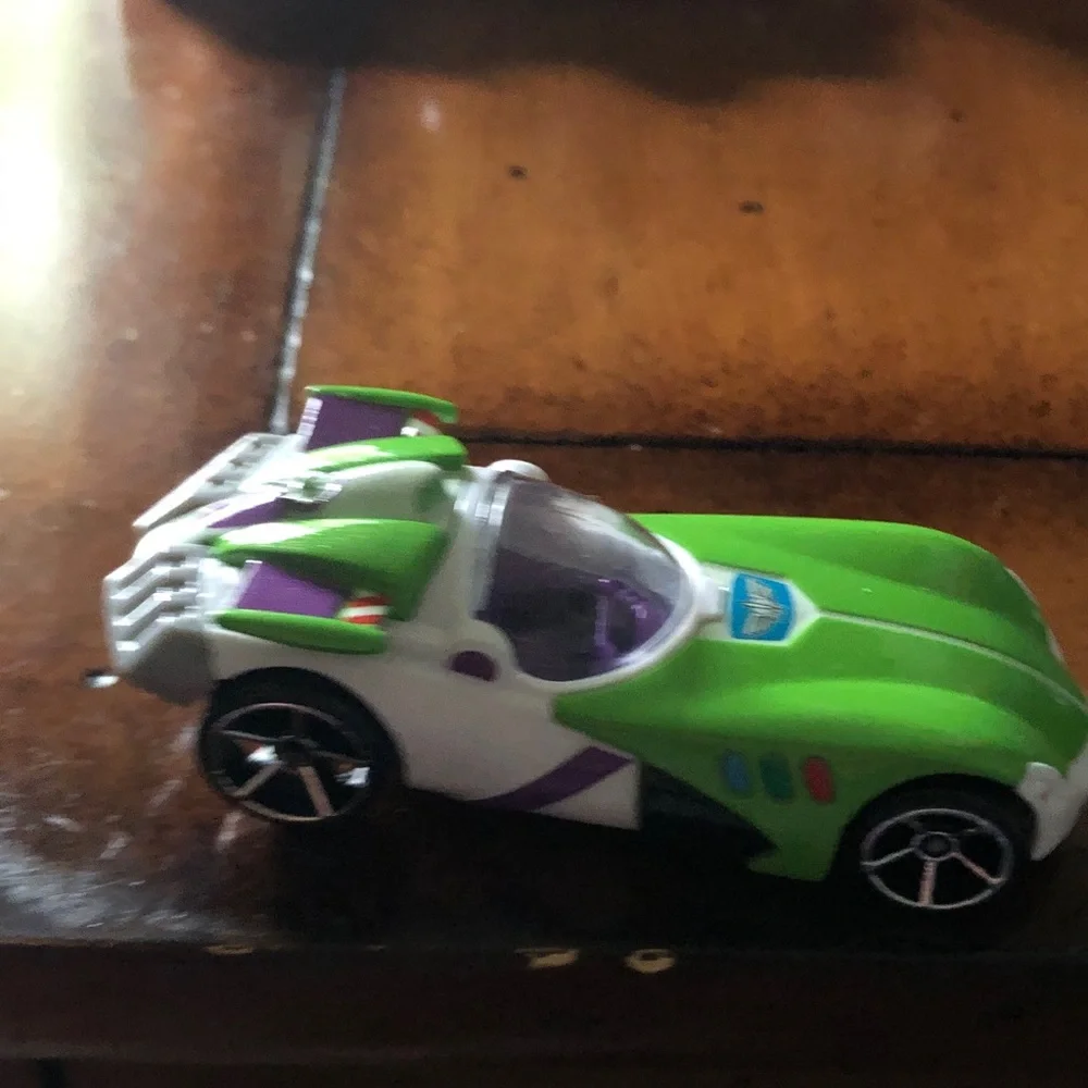 Green Toy Race Car with Purple Accents